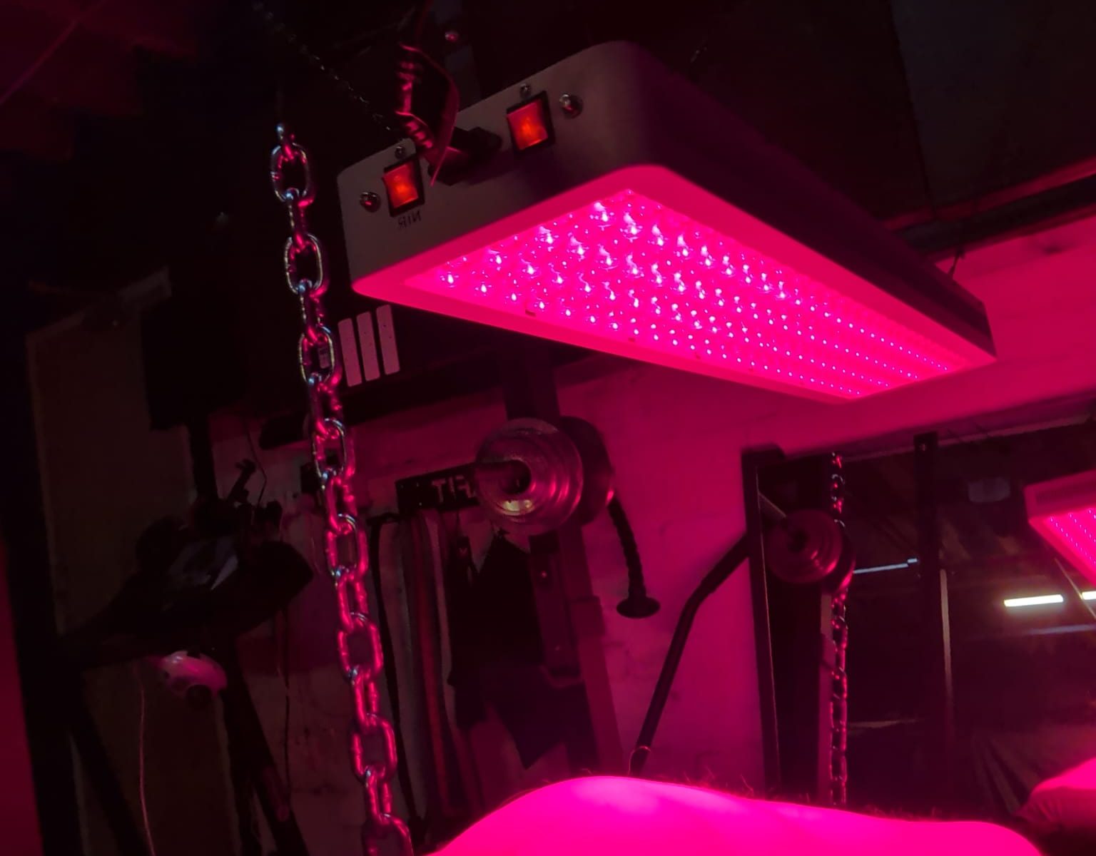 Man laying under a light therapy panel